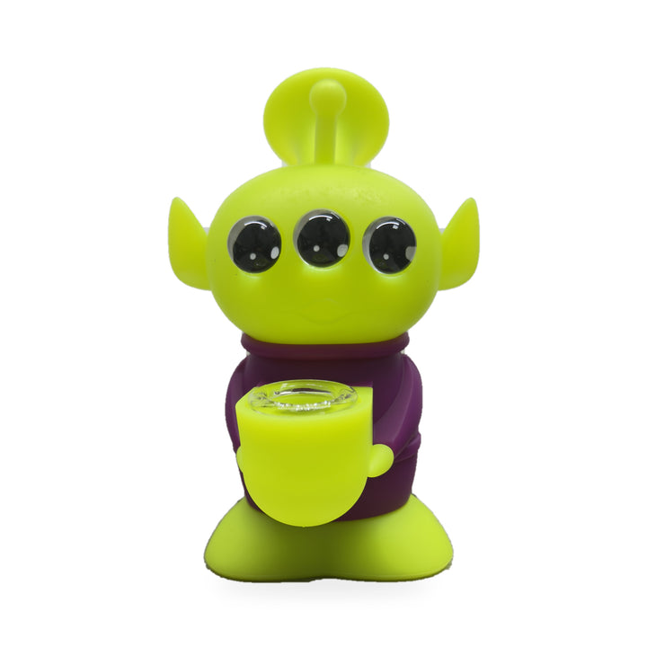 Bong alien de silicona morado de frente, con base verde lima y tres ojos negros brillantes