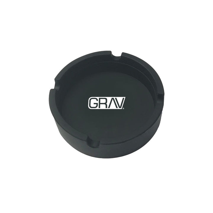 Cenicero de silicona GRAV negro mate con 4 ranuras y logo blanco, visto desde arriba