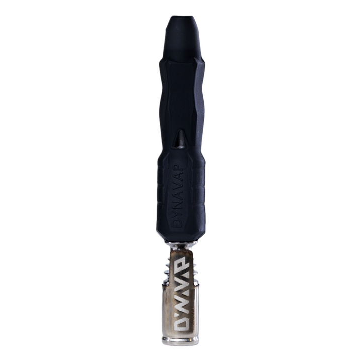 Vaporizador herbal Dynavap B2 en posición vertical con cap metálico colocado.