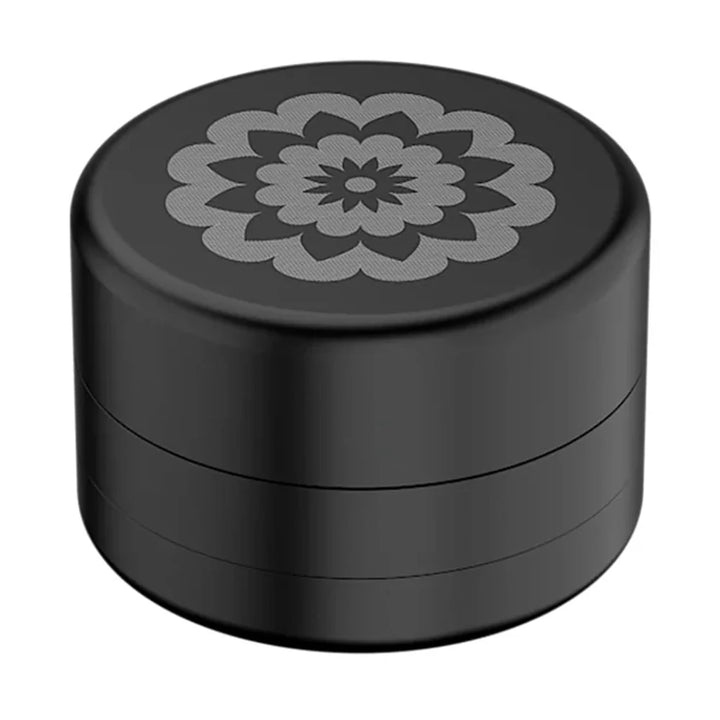 Vista superior del molino de hierba Flower Mill en negro mate con logo mandala plateado