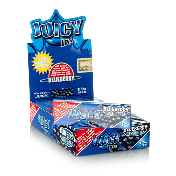 Empaque cerrado de Juicy Jay's Blueberry 1¼ con librillos y la leyenda impresa de uso para hierbas legales